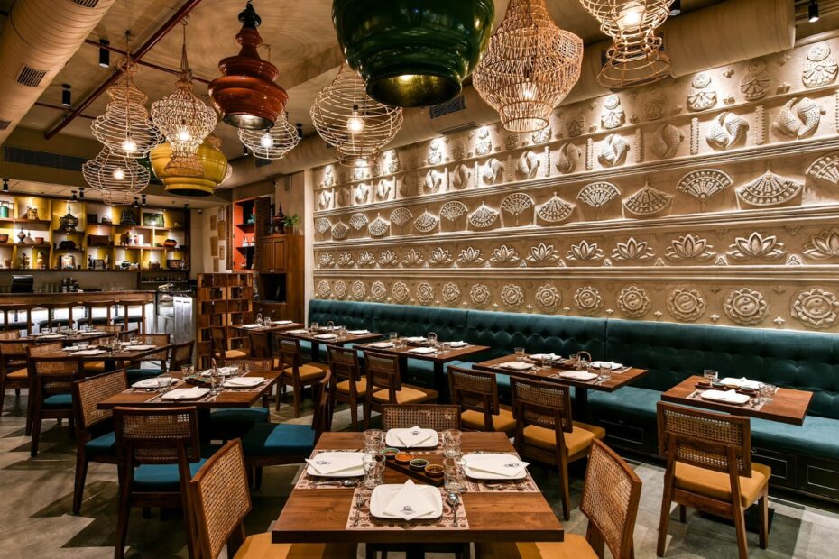Stylish restaurant interior with decorative wall art and neatly set tables