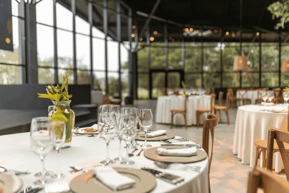 Elegantly set round tables in a bright, modern event space.